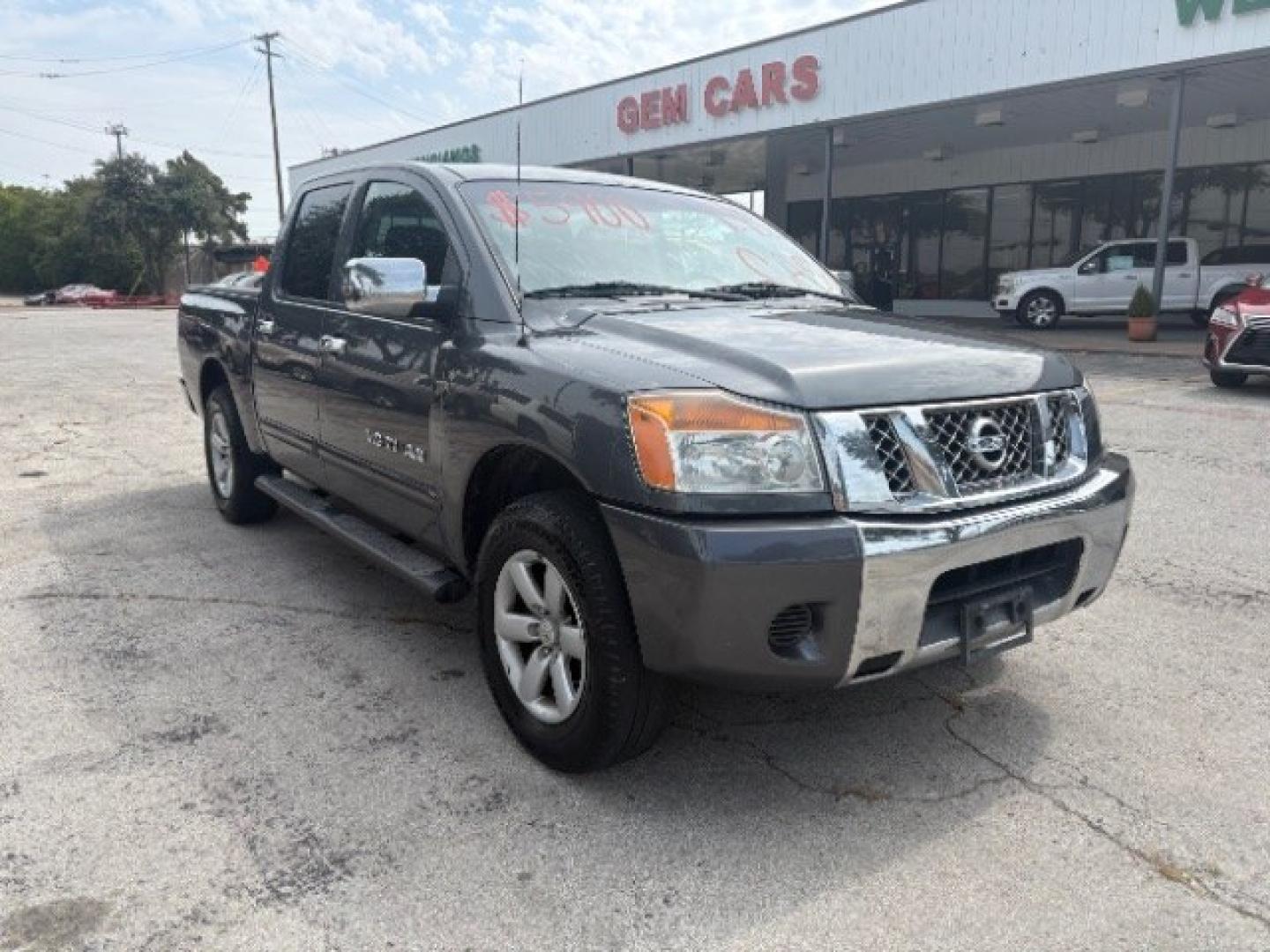 2012 Smoke Metallic /Charcoal Cloth Inter Nissan Titan SV Crew Cab 4WD (1N6BA0EK9CN) with an 5.6L V8 DOHC 32V FFV engine, 5-Speed Automatic transmission, located at 900 South McDonald Street, McKinney, TX, 75069, (972) 529-2992, 33.189335, -96.613403- Photo#1