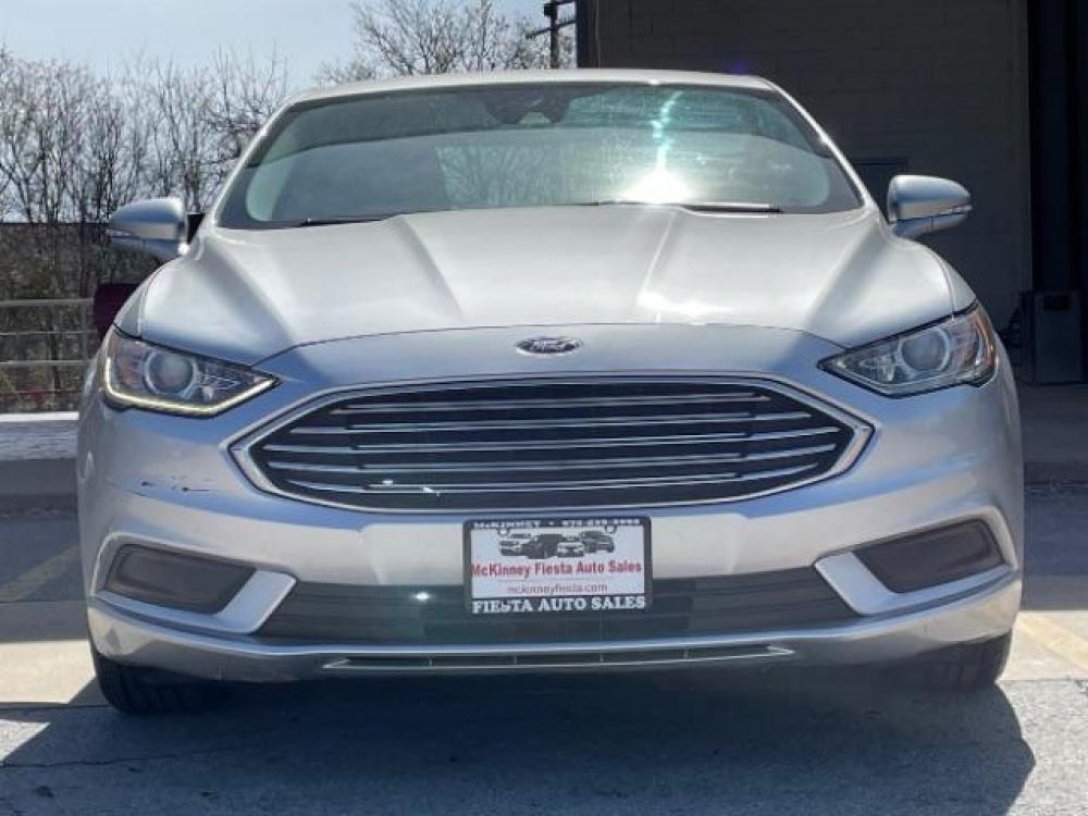 2018 Ingot Silver Metallic /Medium Light Stone, cloth Ford Fusion SE (3FA6P0H79JR) with an 2.5L L4 DOHC 16V engine, 6-Speed Automatic transmission, located at 900 South McDonald Street, McKinney, TX, 75069, (972) 529-2992, 33.189335, -96.613403 - Back up camera, Back up sensors, CD player, Power seats - Photo #1