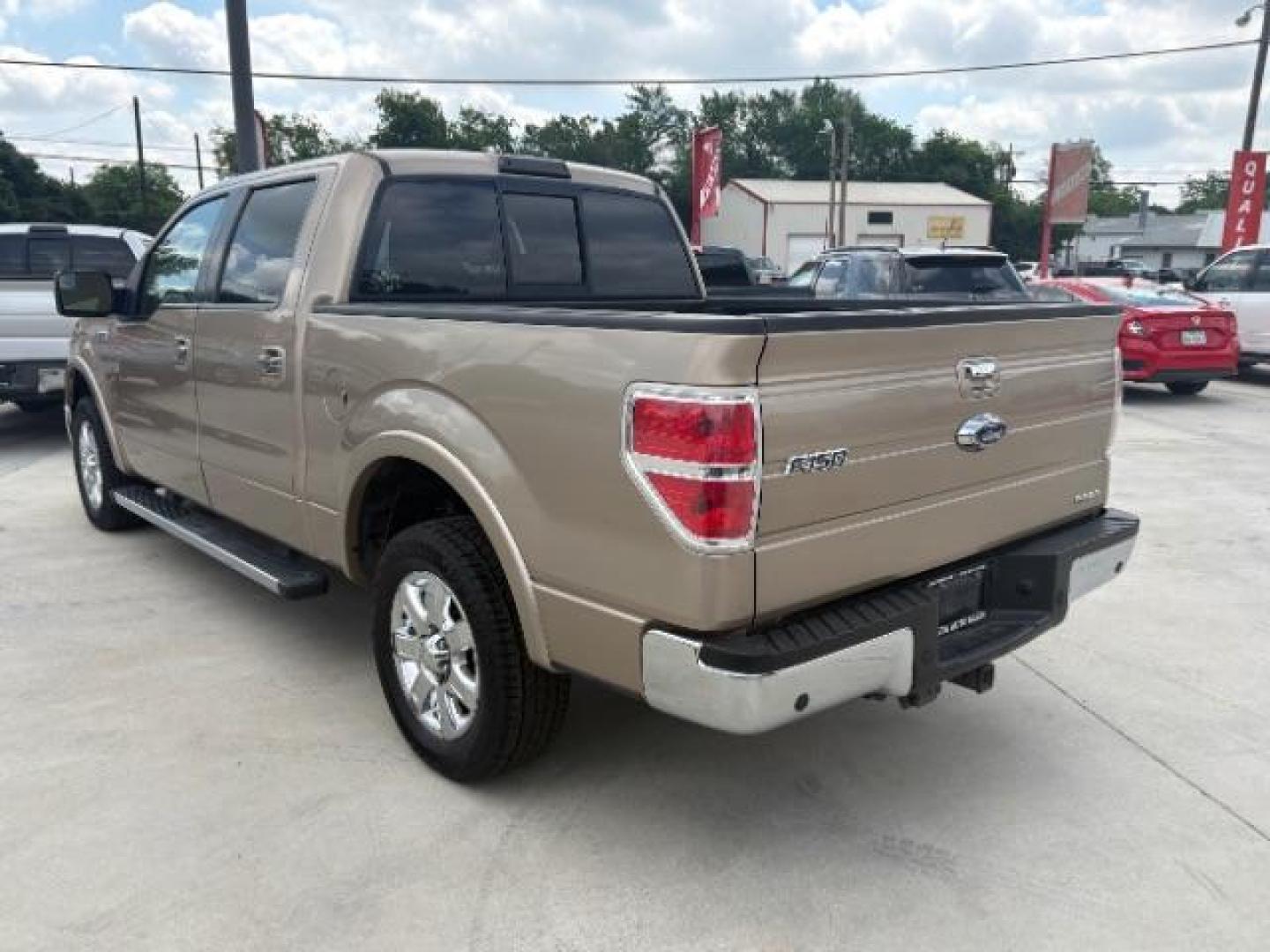 2013 Gold Ford F-150 Lariat SuperCrew 6.5 (1FTFW1CF7DK) with an 5.0L V8 engine, 6-Speed Automatic transmission, located at 900 South McDonald Street, McKinney, TX, 75069, (972) 529-2992, 33.189335, -96.613403 - Photo#2
