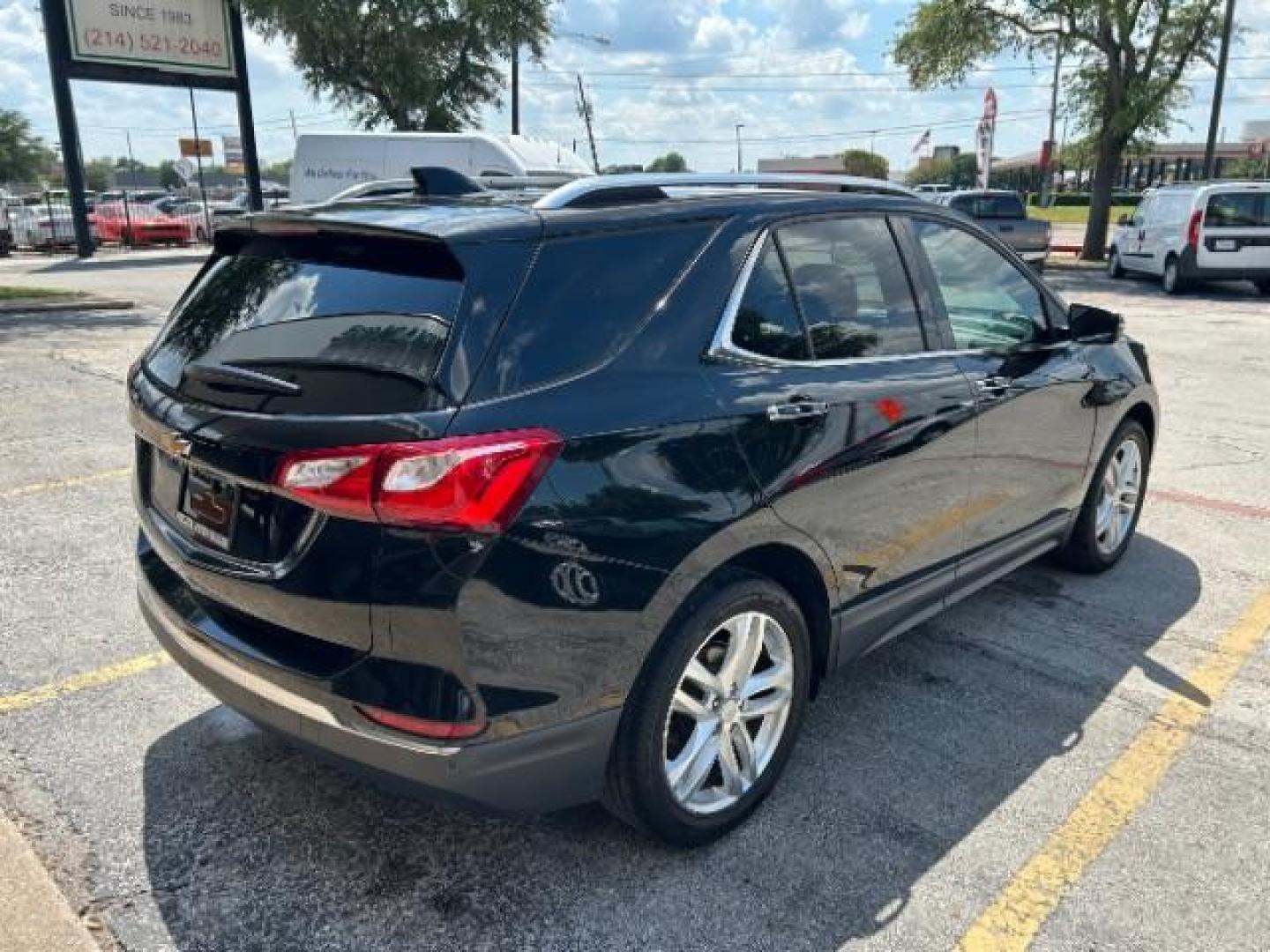 2018 Mosaic Black Metallic /Jet Black Chevrolet Equinox Premier (2GNAXMEV1J6) with an 1.5L I-4 gasoline direct injection engine, Automatic transmission, located at 900 South McDonald Street, McKinney, TX, 75069, (972) 529-2992, 33.189335, -96.613403 - Photo#6