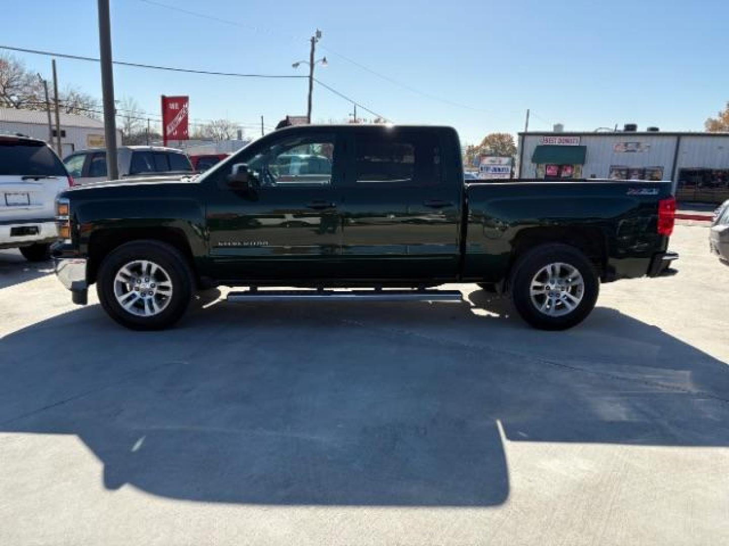 2015 Rainforest Green Met /Dark Ash Seats w/Jet Chevrolet Silverado 1500 LT Crew Cab 4WD (3GCUKREC3FG) with an 5.3L V8 OHV 16V engine, 6-Speed Automatic transmission, located at 900 South McDonald Street, McKinney, TX, 75069, (972) 529-2992, 33.189335, -96.613403 - Photo#1