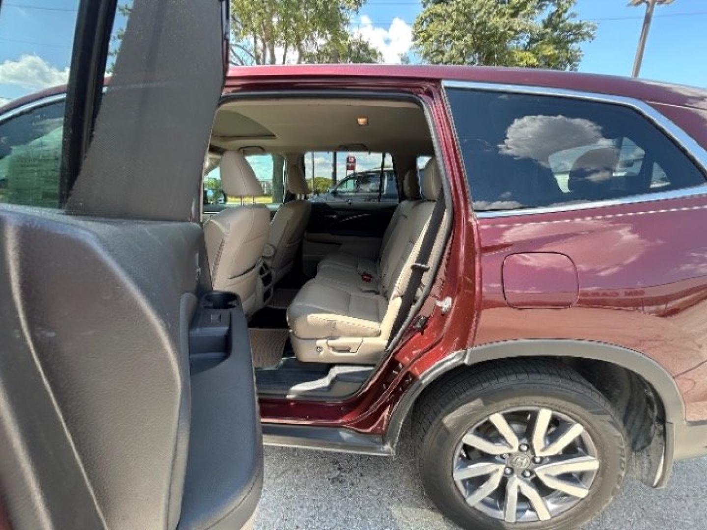 2019 Burgundy /Beige Honda Pilot EX-L (5FNYF5H57KB) with an 3.5L V-6 direct injection engine, Automatic transmission, located at 900 South McDonald Street, McKinney, TX, 75069, (972) 529-2992, 33.189335, -96.613403- Photo#12